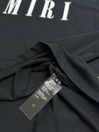Black Amiri T-shirt draped with inner care label