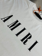 White T-shirt with AMIRI logo lettering close-up