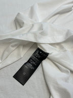 White T-shirt with black care label at side seam