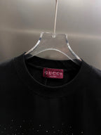 Black Gucci short-sleeve T-shirt neckline with Gucci label inside collar