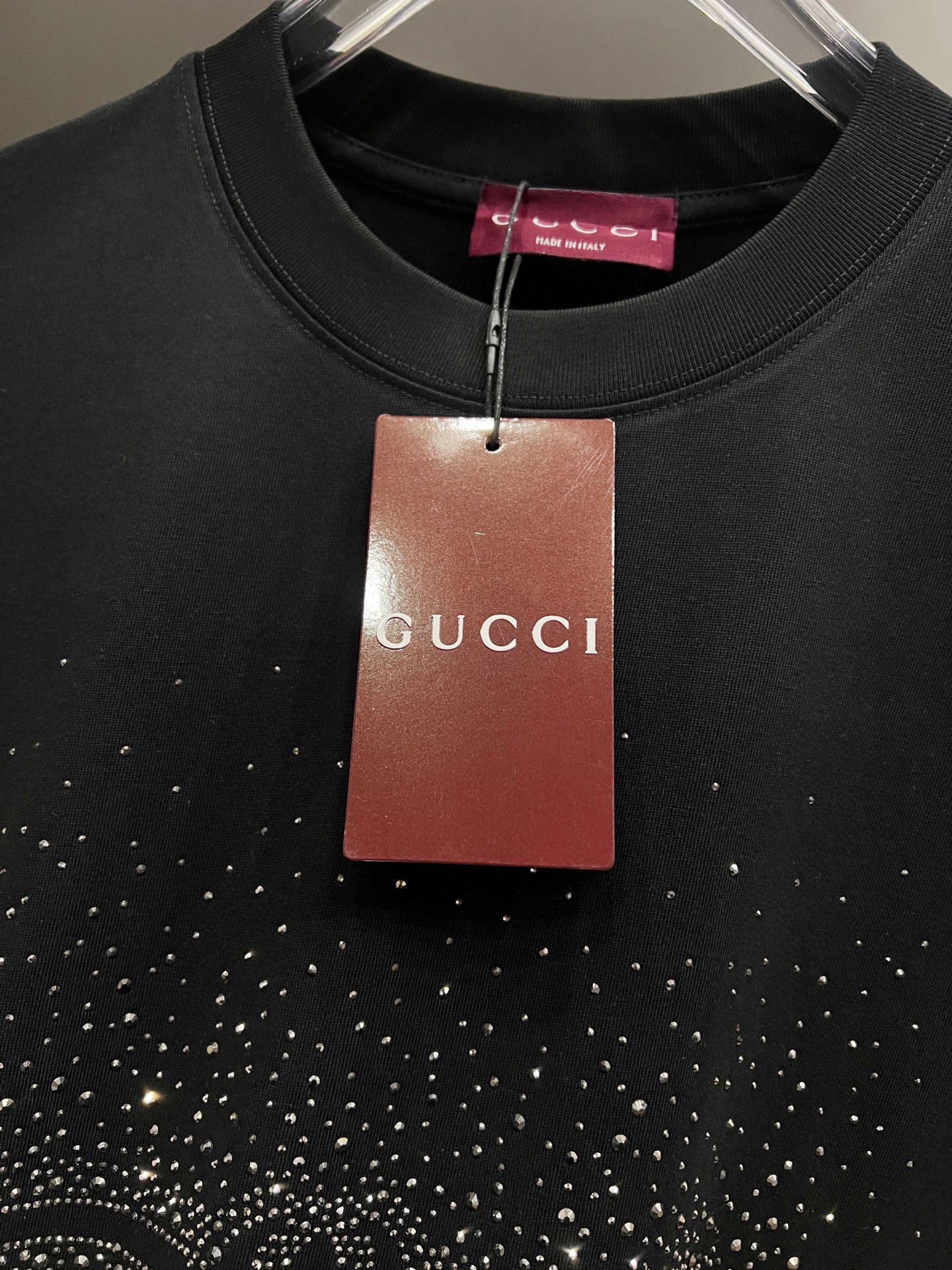 Black Gucci short-sleeve T-shirt with Gucci hang tag and rhinestone emblem