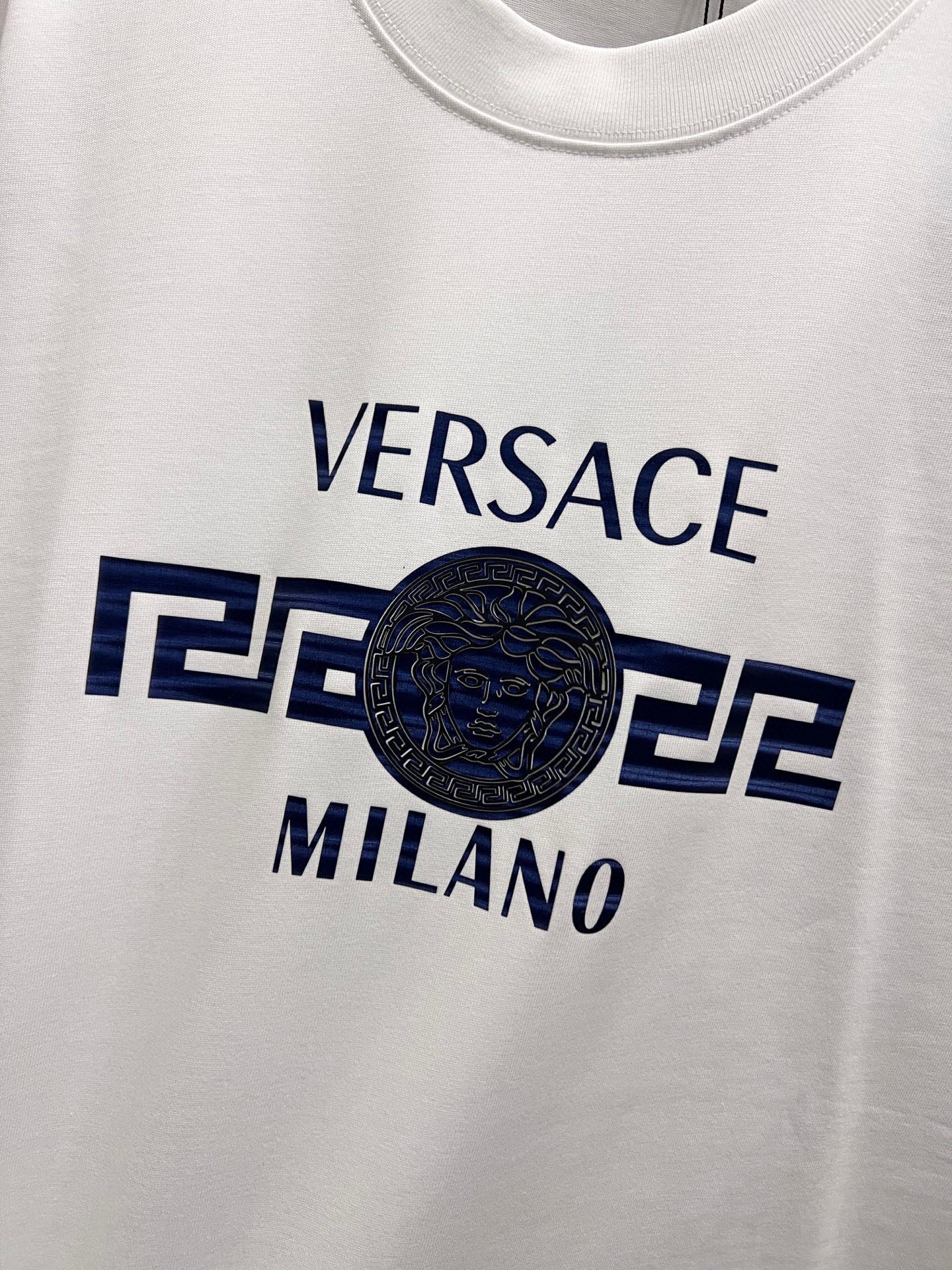 White crewneck T-shirt chest graphic with Versace and Milano text