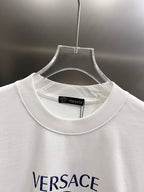White crewneck T-shirt neckline with small inner collar label