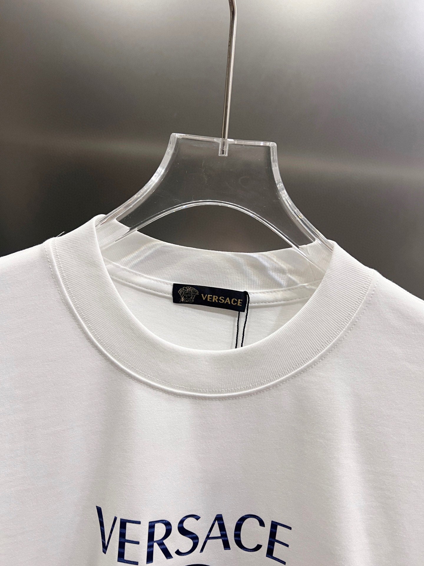 White crewneck T-shirt neckline with small inner collar label