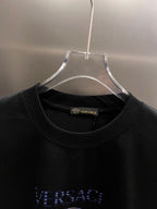 Black T-shirt neckline with Versace tag and stitched collar
