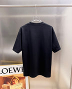 Back of black T-shirt on hanger, no visible print