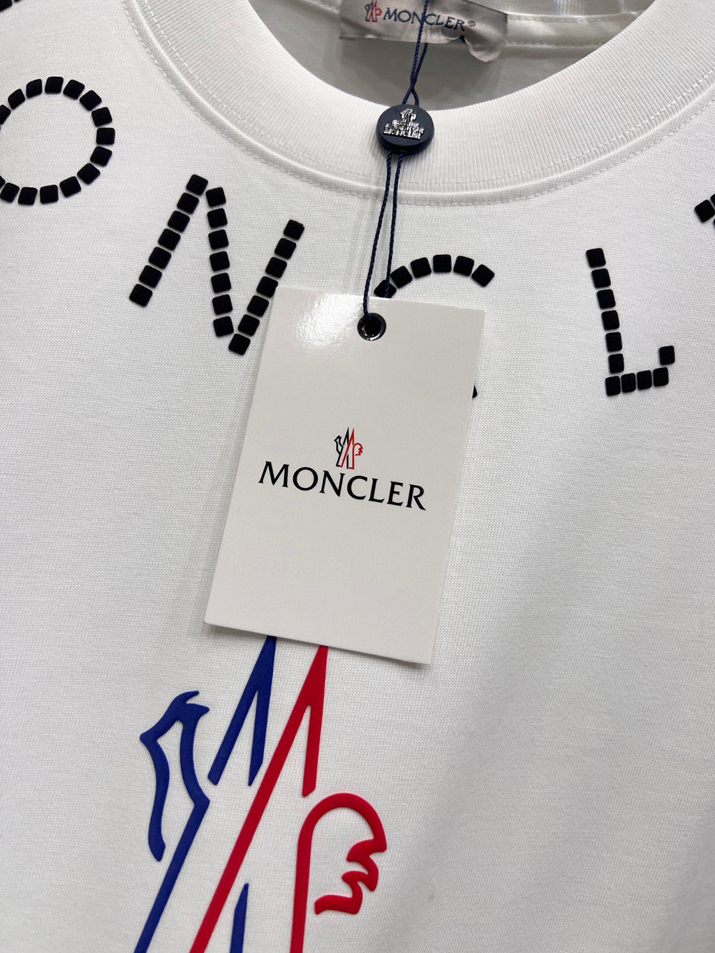 White short-sleeve T-shirt with Moncler hang tag and colorful logo on chest