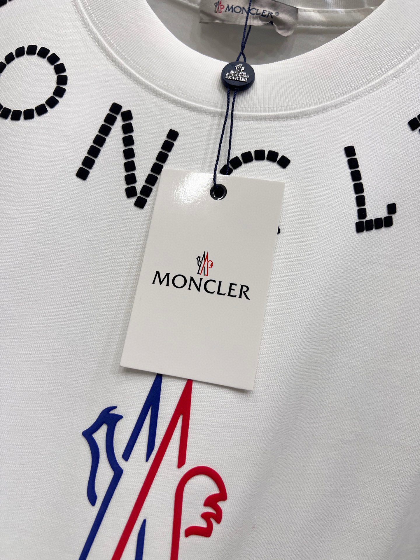 White short-sleeve T-shirt with Moncler hang tag and colorful logo on chest