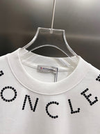 White short-sleeve T-shirt close-up at crew neck with black dotted letter print