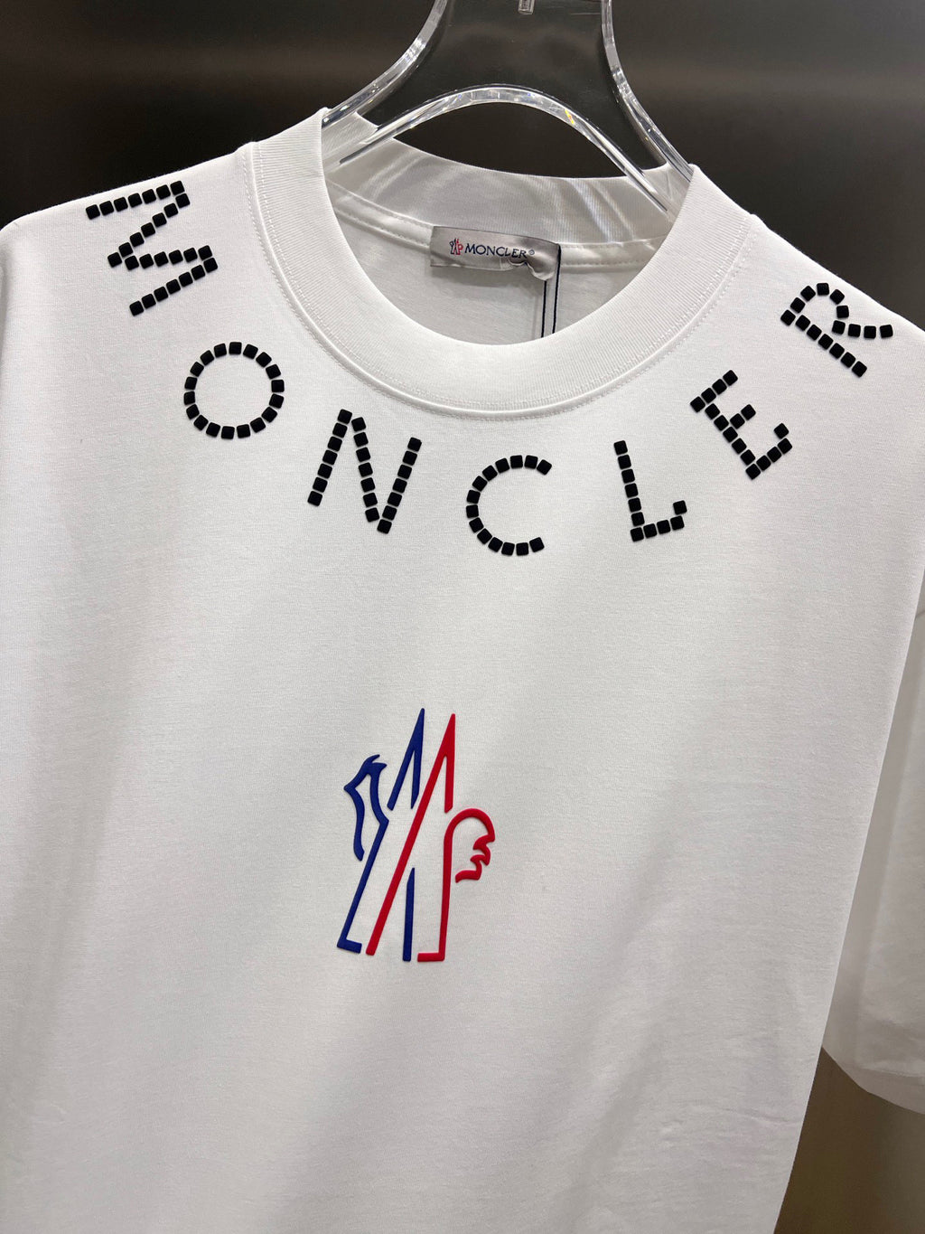 White short-sleeve T-shirt front with black dotted letters and crew neck