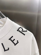 White short-sleeve T-shirt back with black dotted letter graphic