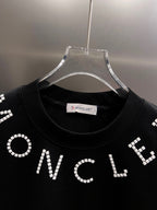 Moncler T-shirt collar, black jersey with white beaded ONCLE lettering
