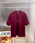 Moncler dark-red short-sleeve T-shirt with front graphic logo and lettering