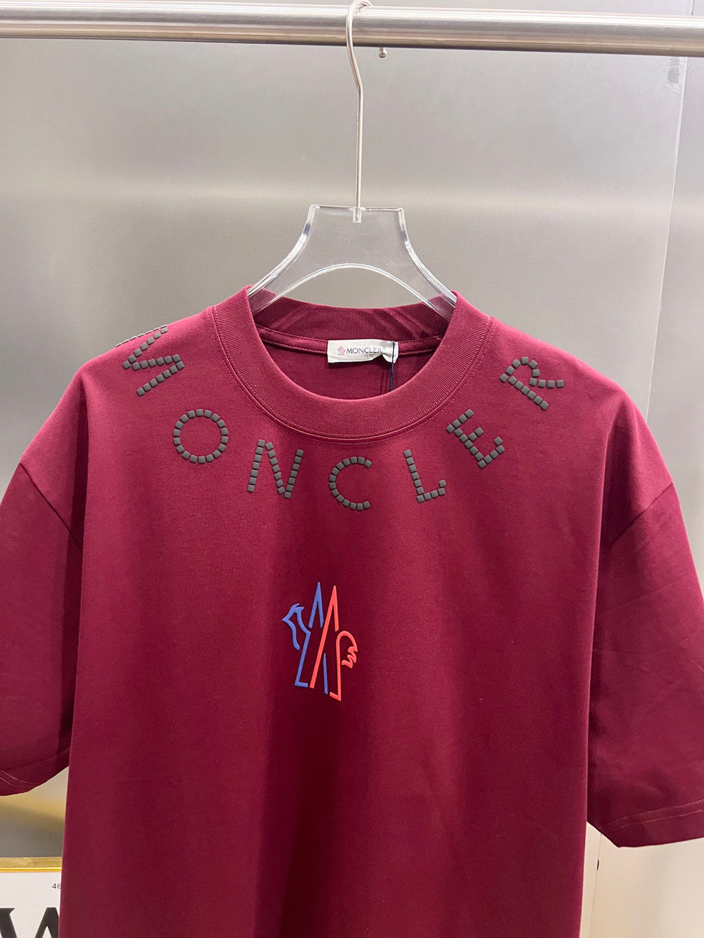 Moncler dark-red short-sleeve T-shirt front view with studded lettering and logo