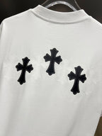 White graphic T-shirt, back view with three black cross designs with light lace outlines