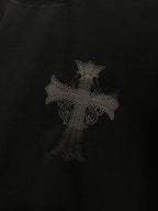 Black T-shirt with subtle dark cross pattern on front
