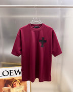 Burgundy short-sleeve T-shirt with black cross emblem on the front.