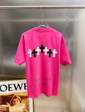 Pink short-sleeve T-shirt with white-and-black cross graphic across the back