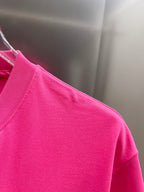 Pink short-sleeve T-shirt from the side on a hanger
