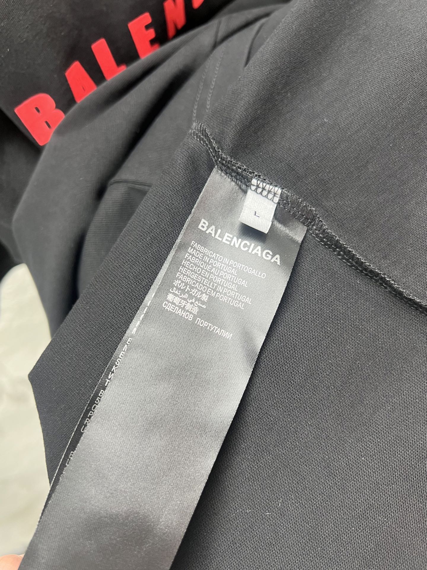 Balenciaga T-shirt fabric label and stitched hem edge