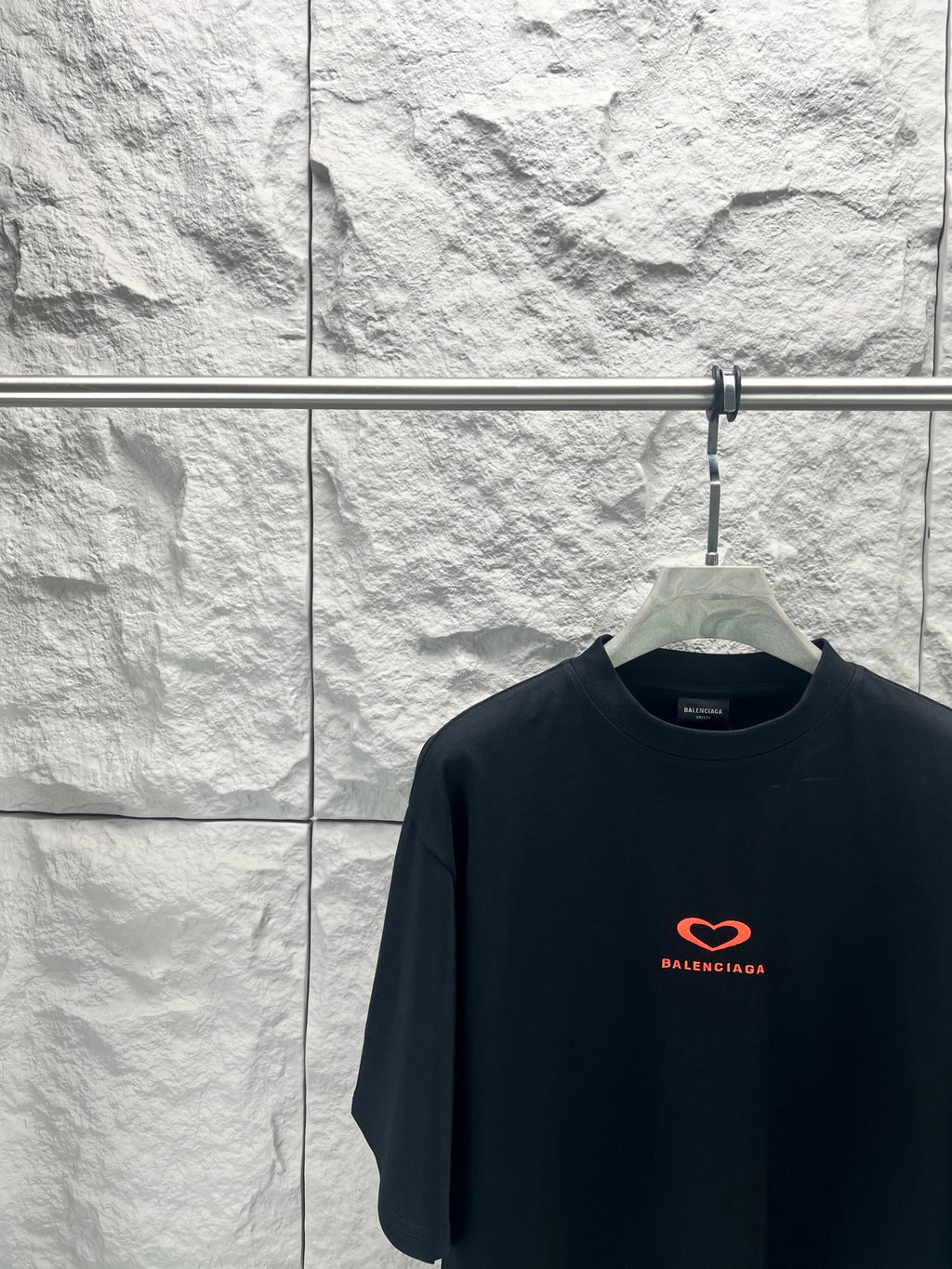 Balenciaga dark T-shirt with small red heart logo on chest