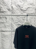 Balenciaga dark T-shirt with small red heart logo on chest