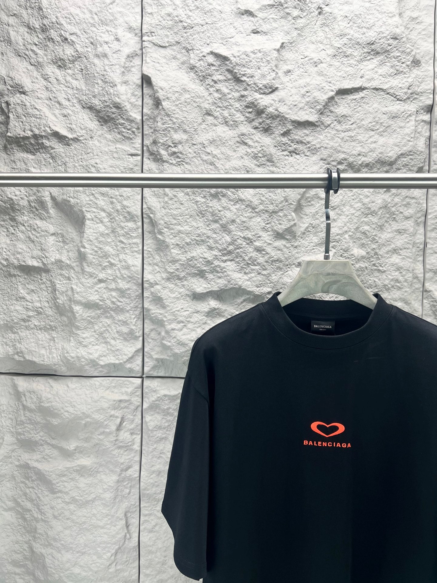 Balenciaga dark T-shirt with small red heart logo on chest