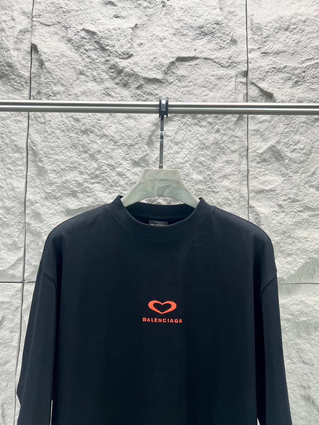 Balenciaga dark T-shirt with small red heart logo on chest