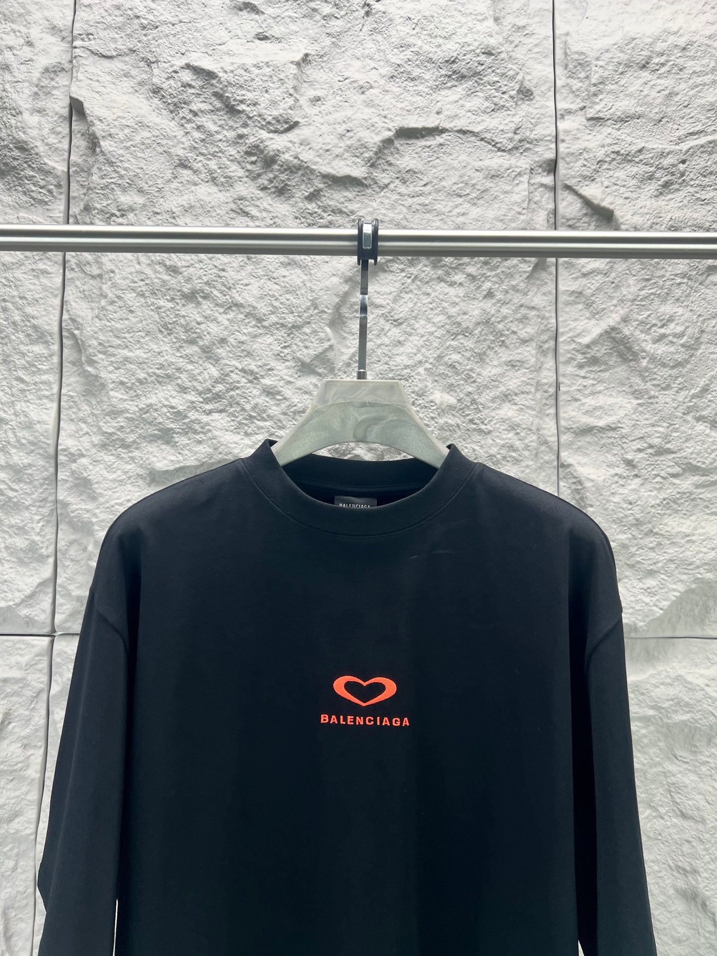 Balenciaga dark T-shirt with small red heart logo on chest