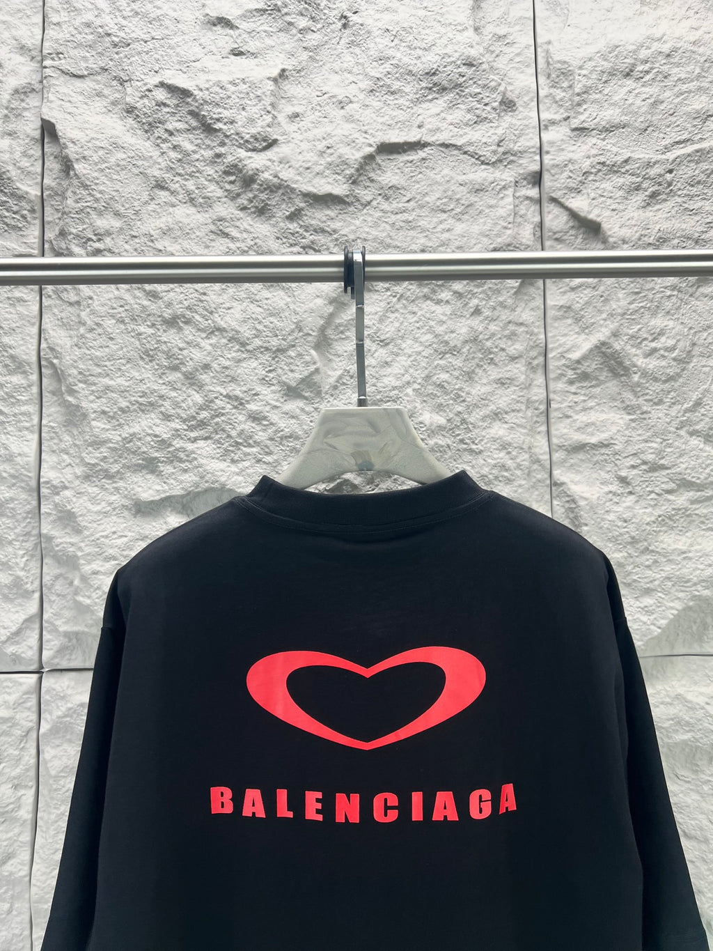 Balenciaga dark T-shirt back with large red heart logo and Balenciaga lettering