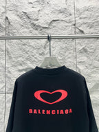 Balenciaga dark T-shirt back with large red heart logo and Balenciaga lettering