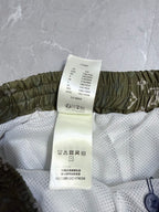 Louis Vuitton shorts with size care label and elastic waistband, olive and white