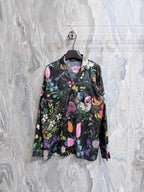 Gucci floral long-sleeve shirt on dark base with colorful flowers and butterflies