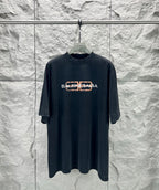 Dark navy Balenciaga short-sleeve T-shirt with orange logo on chest