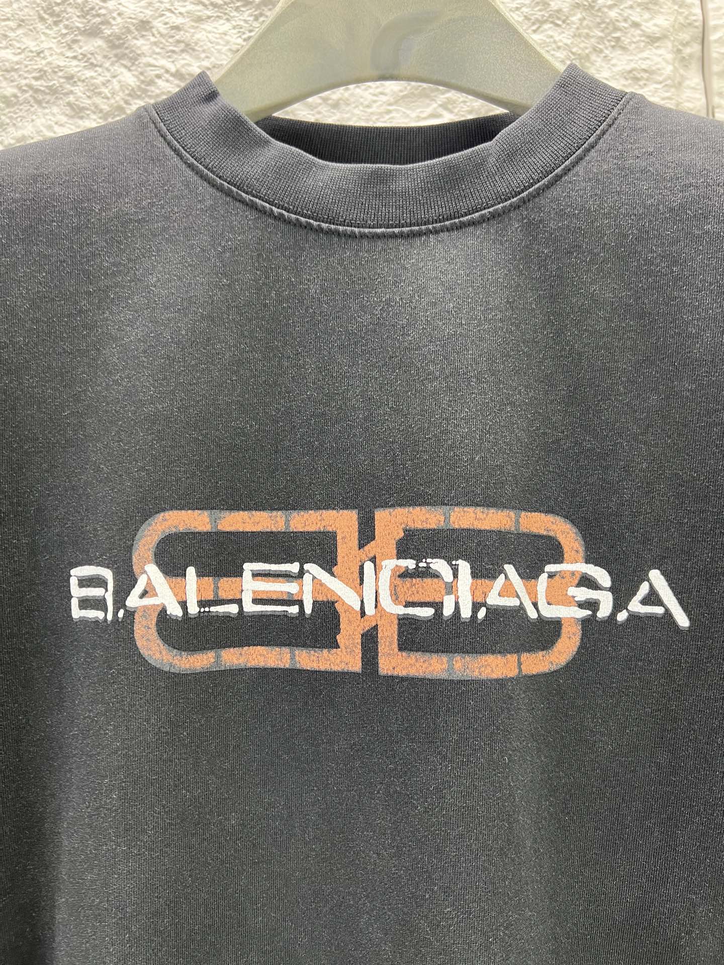 Gray Balenciaga short-sleeve T-shirt with orange and white logo