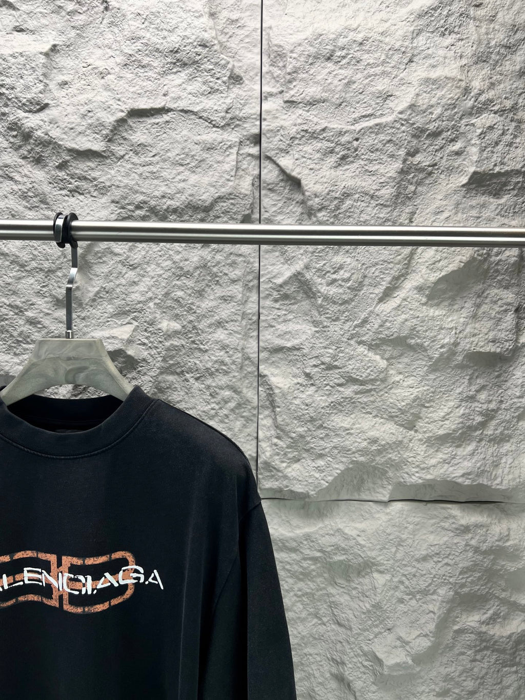Dark navy Balenciaga short-sleeve T-shirt with partial orange logo detail