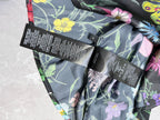 Floral long-sleeve shirt neckline and sleeve seam with black care labels