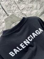 Balenciaga black short-sleeve T-shirt side view, crew neck, slanted BALENCIAGA lettering