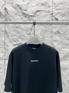 Balenciaga black short-sleeve T-shirt on hanger, crew neck, small center chest logo