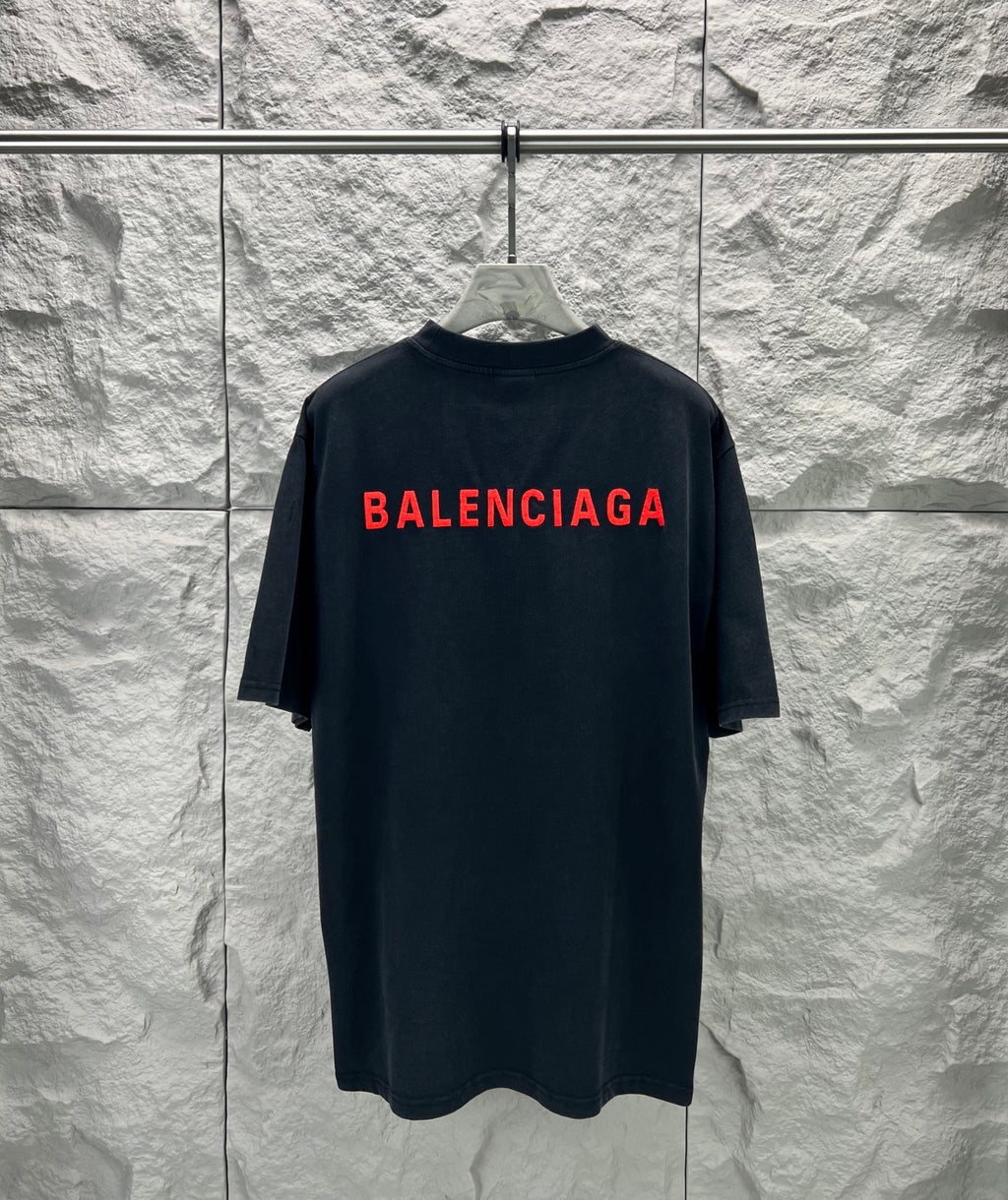 Black short-sleeve shirt with large red Balenciaga logo across back