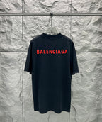 Black short-sleeve shirt with large red Balenciaga logo across back