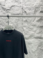Black short-sleeve shirt neckline with small red Balenciaga logo on chest