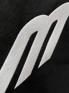 Close-up of Balenciaga logo graphic on black fabric