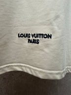 Louis Vuitton T-shirt with 'LOUIS VUITTON PARIS' print near the hem.