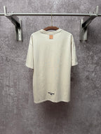 Louis Vuitton T-shirt in light cream with small back logo and crew neckline.
