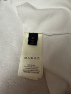 T-shirt size label: XL, Made in Italy, care instructions on inner tag
