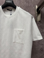 White short-sleeve T-shirt with crew neck and front chest pocket, close-up