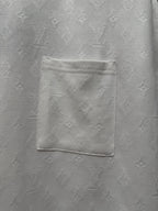 White T-shirt chest pocket detail with embossed textured fabric