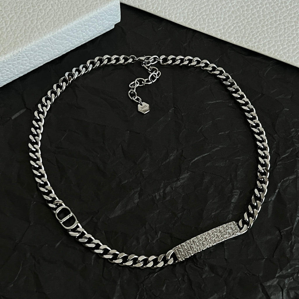 Silver-tone chain necklace with engraved bar and two heart-shaped charms
