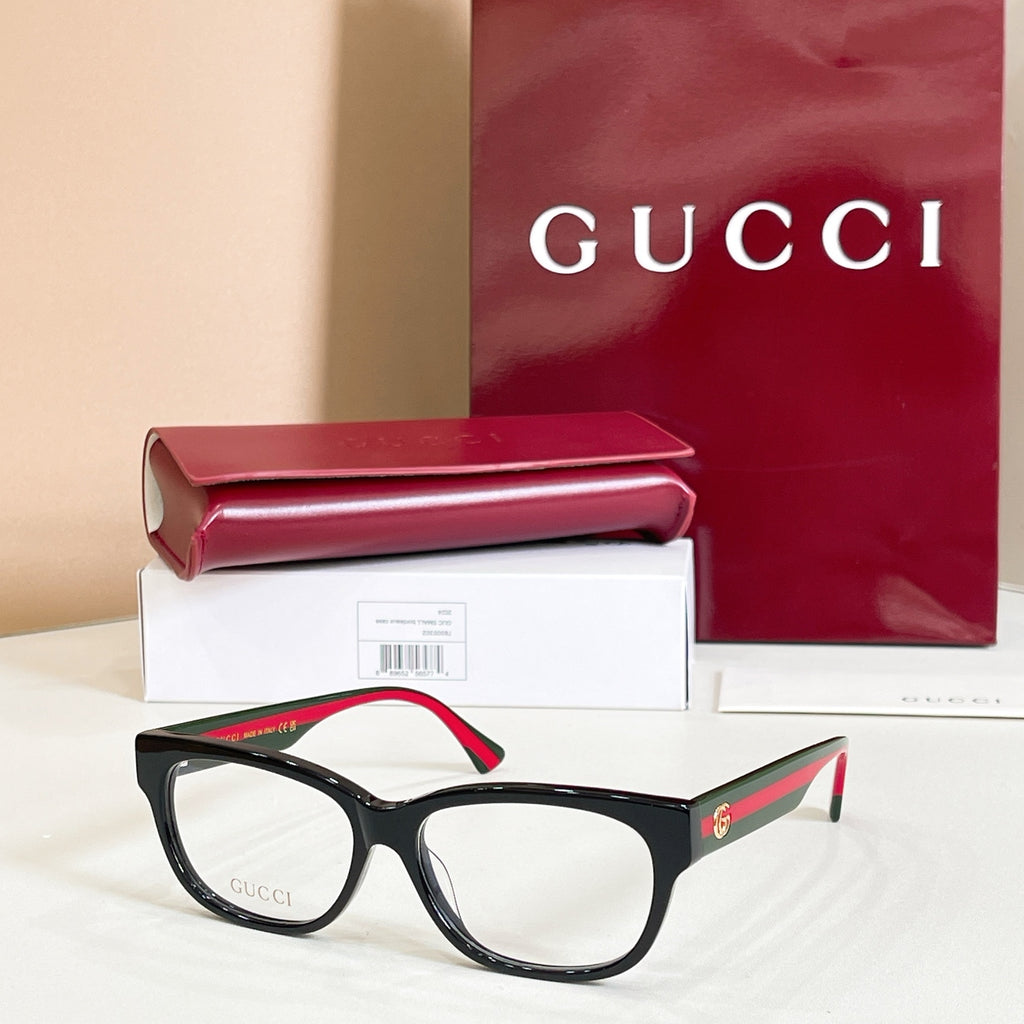 Black rectangular glasses with red and green striped temple details, with case and box.